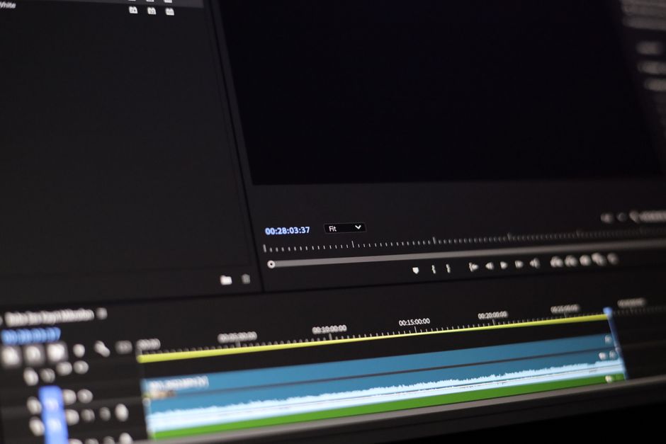 Professional editor color grading a cinematic wedding film