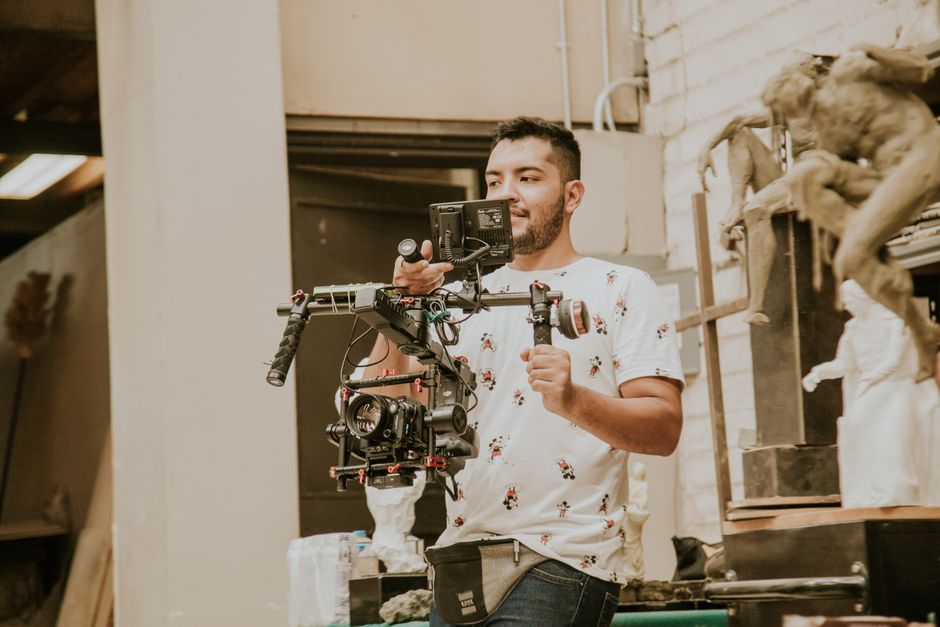 A professional wedding videographer capturing a beautiful cinematic wedding scene
